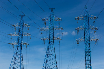 Electrical power lines on a blue sky background.