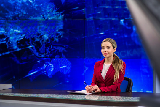 News anchor in the TV Studio . Beautiful girl reading the news, on a blue  screen background Stock Photo | Adobe Stock