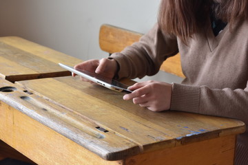 Student at desk with Ipad