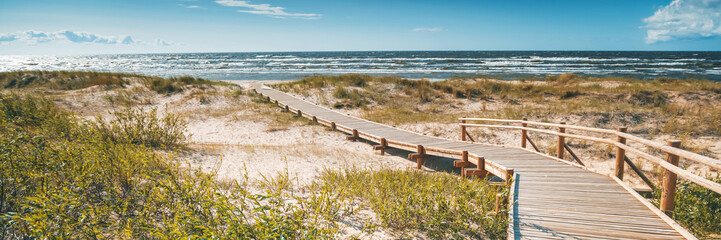 Wooden path to the Baltic Sea, the beauty of northern nature