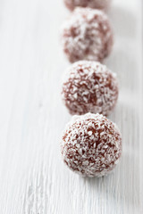 Homemade natural candy made from nuts, fruit dates and coconut. Healthy vegan food.