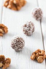 Homemade natural candy made from nuts, fruit dates and coconut. Healthy vegan food.