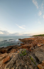 Fototapeta na wymiar Sunrise between rocks and the Oropesa Sea