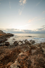 Sunrise between rocks and the Oropesa Sea