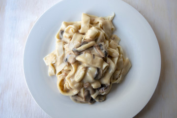 Homemade Italian fettuccine pasta with mushrooms and cream sauce