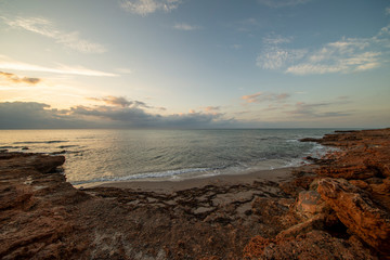Sunrise between rocks and the Oropesa Sea