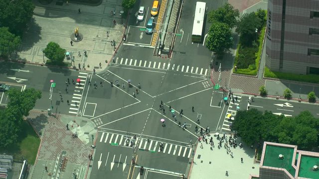 TAIPEI, TAIWAN - CIRCA AUGUST 2019 : Aerial high angle view of street traffic and junction in Taipei. Located at Xinyi district.