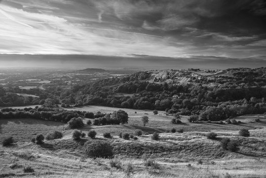 Stunning  black and white landscape image of view over English countryside during Summer sunset with soft light