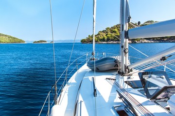 Sailing boat near Croatian island Lastovo. View from the deck of the yacht. Vacation on a boat. Sailing on the sea.