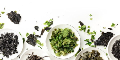 A panorama of dry seaweed, sea vegetables, shot from the top on a white background with a place for text and logo