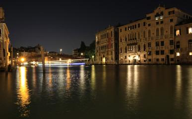 The nighttime beauty of Venice and the lights of the city. Italy.