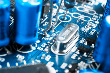 Macro shot of a Circuitboard with resistors microchips and electronic components. Computer hardware...