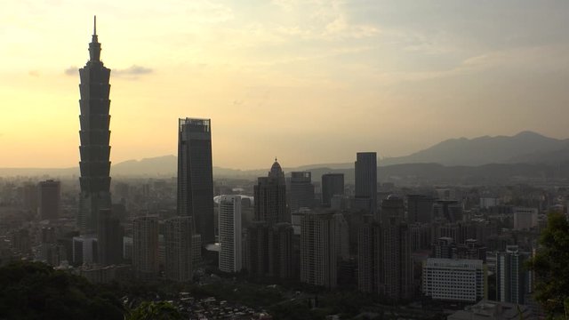 TAIPEI, TAIWAN - CIRCA AUGUST 2019 : Aerial view of cityscape of Taipei at sunset time. View of shopping and business district at Xinyi area.