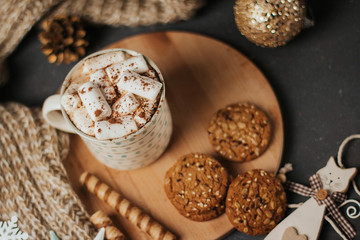 Plakat Cup of coffee or cocoa with marshmallows, sweets, knitted plaid and Christmas toys.