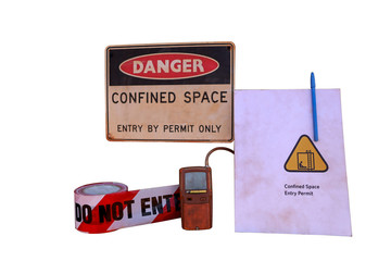 Danger confined space entry by permit only warning sign, barricade danger tape, gas leak test...