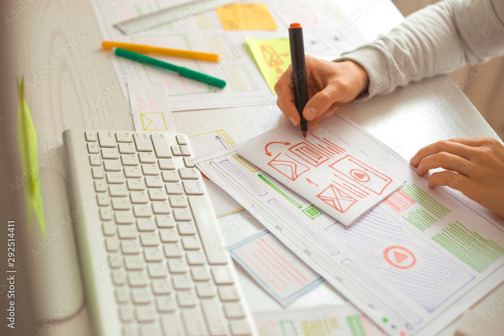 Poster website designer creates a sketch application. developing a project drawing an interface mockup.