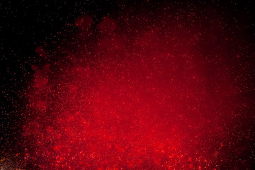red sparks of fireworks in the dark sky