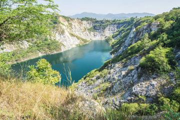 Beautiful landscape view of rocks mountain with lake and tree.