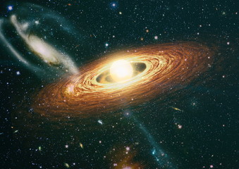 Spiral galaxy in deep space. Stars of a planet and galaxy in a free space. Colored nebula and open cluster of stars in the universe. Elements of this image furnished by NASA.