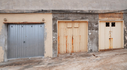 Obraz na płótnie Canvas Three gates in a row in grungy concrete wall