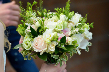 Bridal bouquet being held on wedding day.