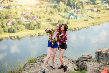 positive attractive hikers posing to smartphone, showing victory gesture, body language, pastime, leisure, full length photo