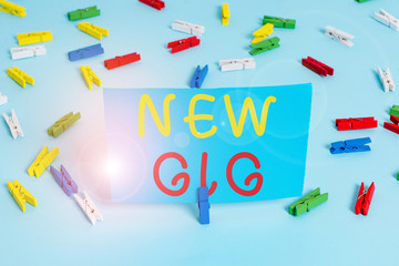 Handwriting text New Gig. Conceptual photo getting job Attending live Concert Gigabyte Freelancer offer Colored clothespin papers empty reminder blue floor background office pin