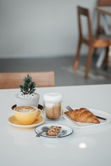 breakfast with coffee and croissant
