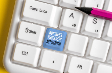 Conceptual hand writing showing Business Processes Automation. Concept meaning performed to achieve digital transformation White pc keyboard with note paper above the white background