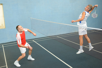 Obraz premium team of badminton players in gym
