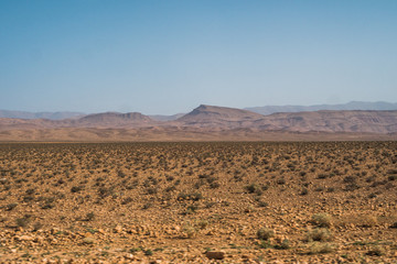 Beautiful scenic panoramic view of the canyons and plain fields in Morocco close to the Sahara Desert