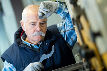 portrait of a tired senior worker