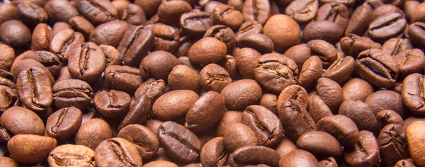 Coffee beans as a background, panoramic view.