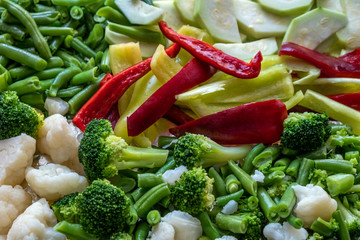 Mixed vegetables background: Broccoli, carrots, cauliflower, pepper and green beans. Organic salad