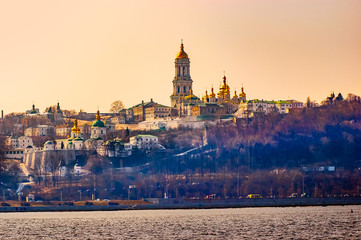A view of the golden steeples of the Kiev Pechersk Lavra Monastery, in Kiev, Ukraine, seen from the left bank of the Dnieper river during winter
