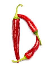 English alphabet made of chili peppers on white background. Font made of hot red chili pepper isolated - letter D.
