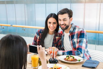 Family Sitting Together in the Restaurant Lunch Concept