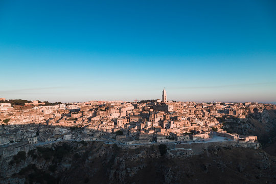 Matera, Italy - August 2019: View of the ancient city of Matera from the Belvedere of Murgia Timone, at the dawn of a day in August 