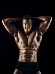 Fototapeta na wymiar muscular man on black background