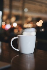cup of coffee with sugar on wooden table