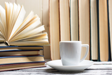 Open book, hardback books on wooden table. Back to school. Copy space
