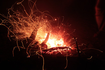 Bonfire close-up shot on a long exposure on a dark background.