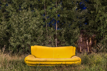 Yellow Sofa on a Meadow, Bulky waste at night