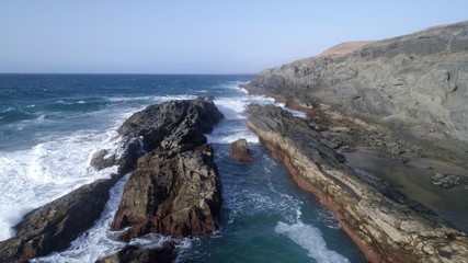 landscape and sunset on the coast contemplating the breaking of the waves on the cliffs