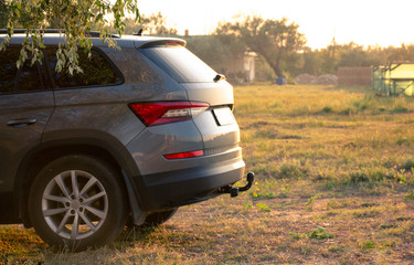 Russia, Krasnodar - September 19, 2019. Car against the backdrop of a rural landscape at dawn in summer