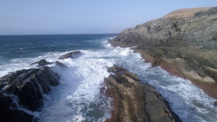 landscape and sunset on the coast contemplating the breaking of the waves on the cliffs