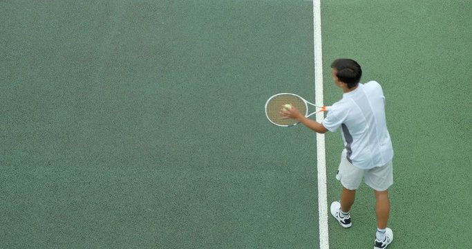 A Tennis player serves an 'Ace' and punches the air in celebration.