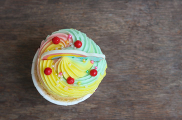 Rainbow cupcake beautiful color fancy cake with sugar topping fun for break time without tea