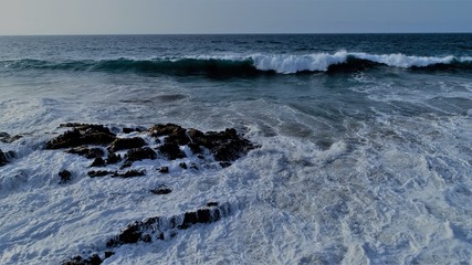 landscape and sunset on the coast contemplating the breaking of the waves on the cliffs