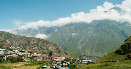 View of Caucasus Mountains and Stepantsminda village